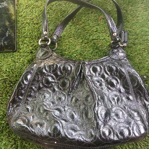 Black monagrammed coach   see